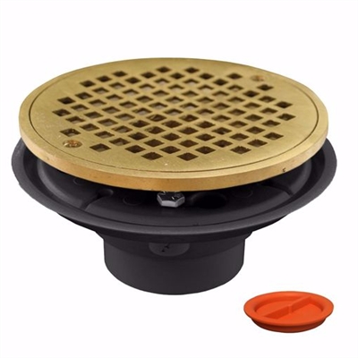 Jones Stephens 2 inch x 3 inch PVC Shower Drain with 2 inch Brass Spud and 6 inch Round Polished Brass Strainer with Test Plug D50802TP